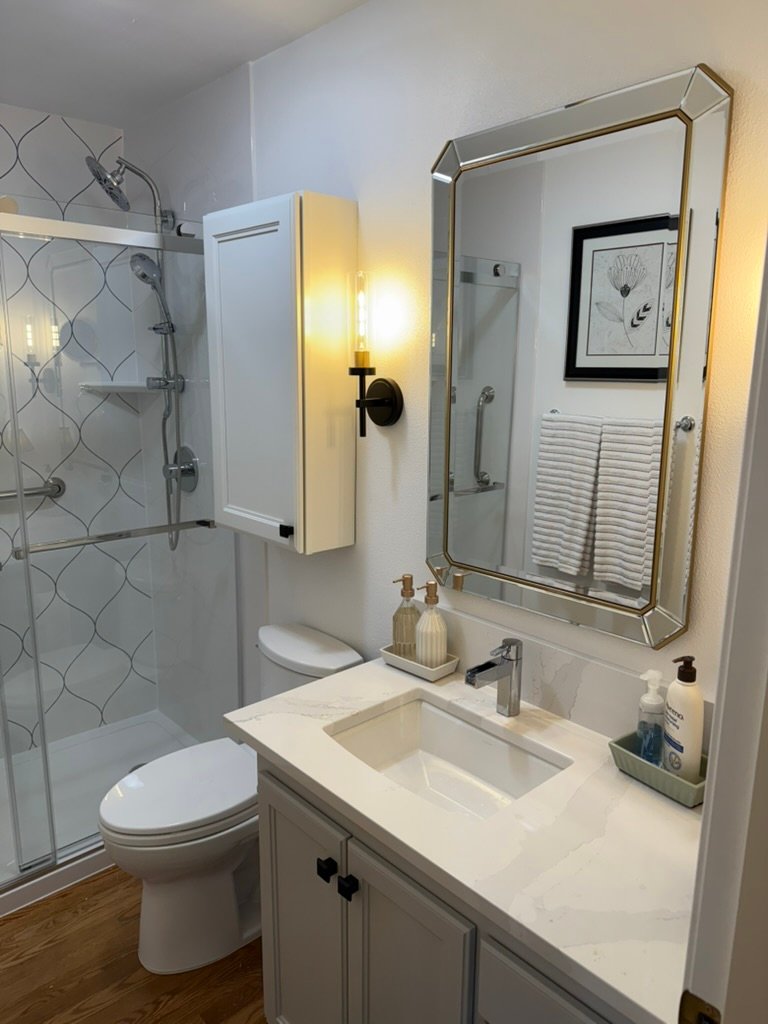 finished bathroom remodel with glass shower door